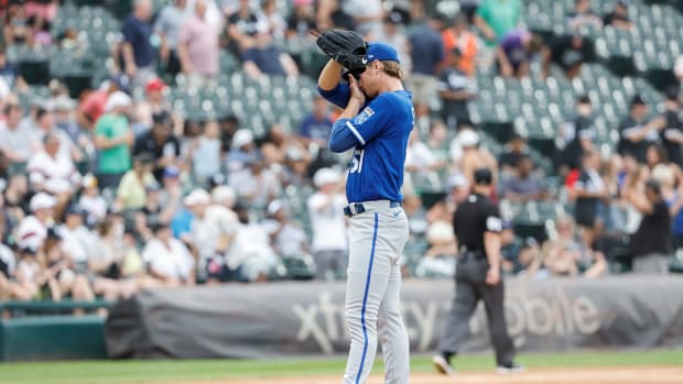 Aug 3, 2022; Chicago, Illinois, USA; Kansas City Royals starting pitcher Brady Singer (51) reacts after giving up a three-run home run to Chicago White Sox first baseman Jose Abreu during the third inning at Guaranteed Rate Field. Mandatory Credit: Kamil Krzaczynski-USA TODAY Sports